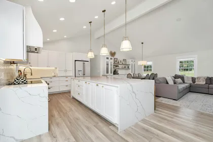 Modern renovated kitchen with white cabinetry and island